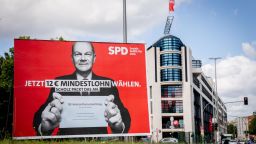 With a large-scale election poster featuring a photo of Olaf Scholz, SPD candidate for Chancellor and Federal Minister of Finance, the SPD is advertising "12 · minimum wage" in front of its party headquarters, on August 11, 2021 in Berlin. 