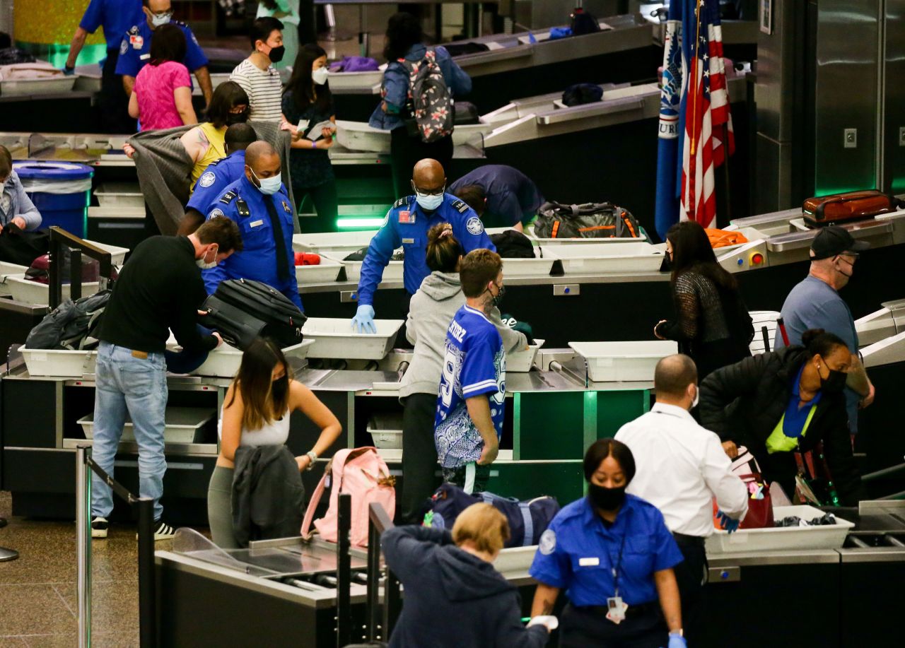 Travelers go through a security checkpoint at Seattle-Tacoma International Airport on November 24.