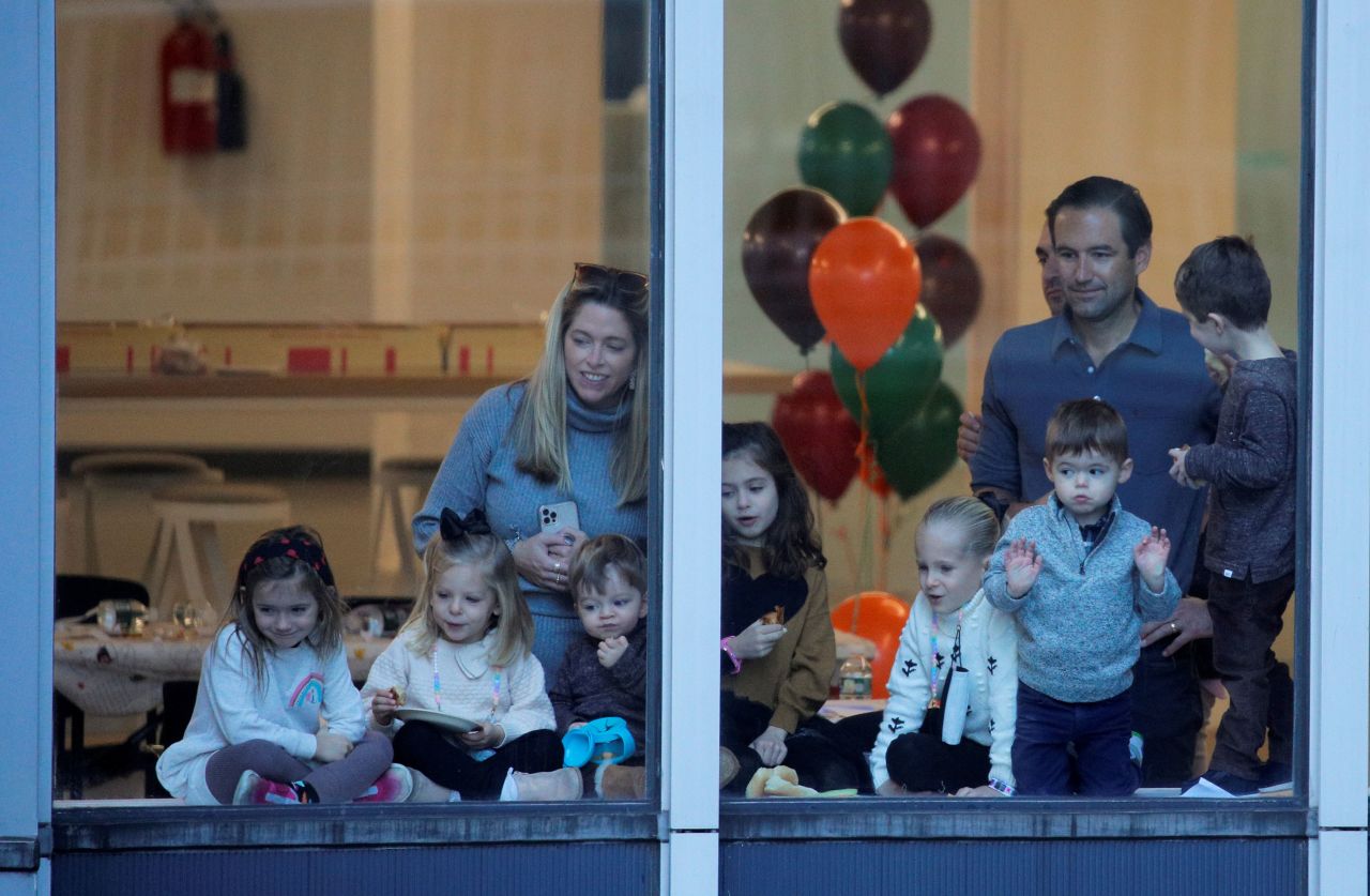 People watch the Macy's parade from a window in Manhattan.
