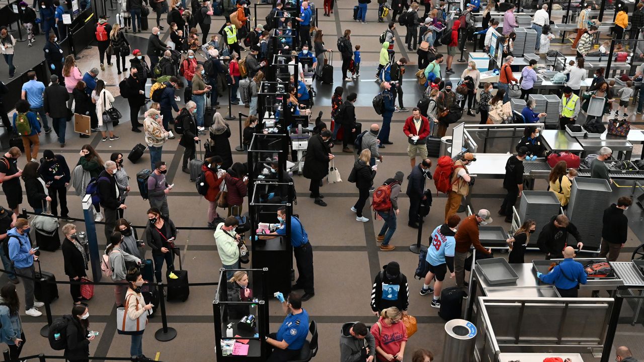 Travelers make their way through TSA security at Denver International Airport the day before Thanksgiving on November 24, 2021 in Denver, Colorado. 