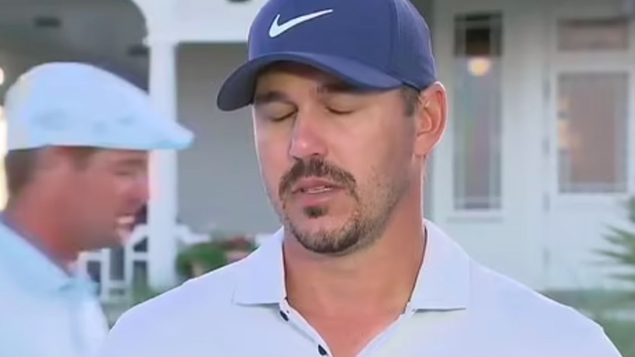 Koepka rolls his eyes and loses his train of thought as DeChambeau walks behind him at the 2021 PGA Championship. 