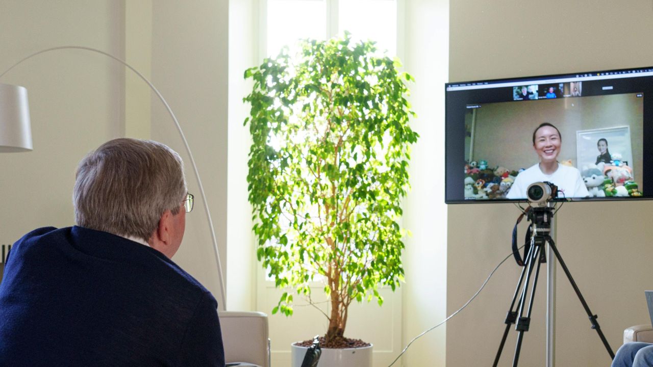 A handout photo made available by the IOC shows the organization's president Thomas Bach holding a video call with Peng Shuai on 21 November.