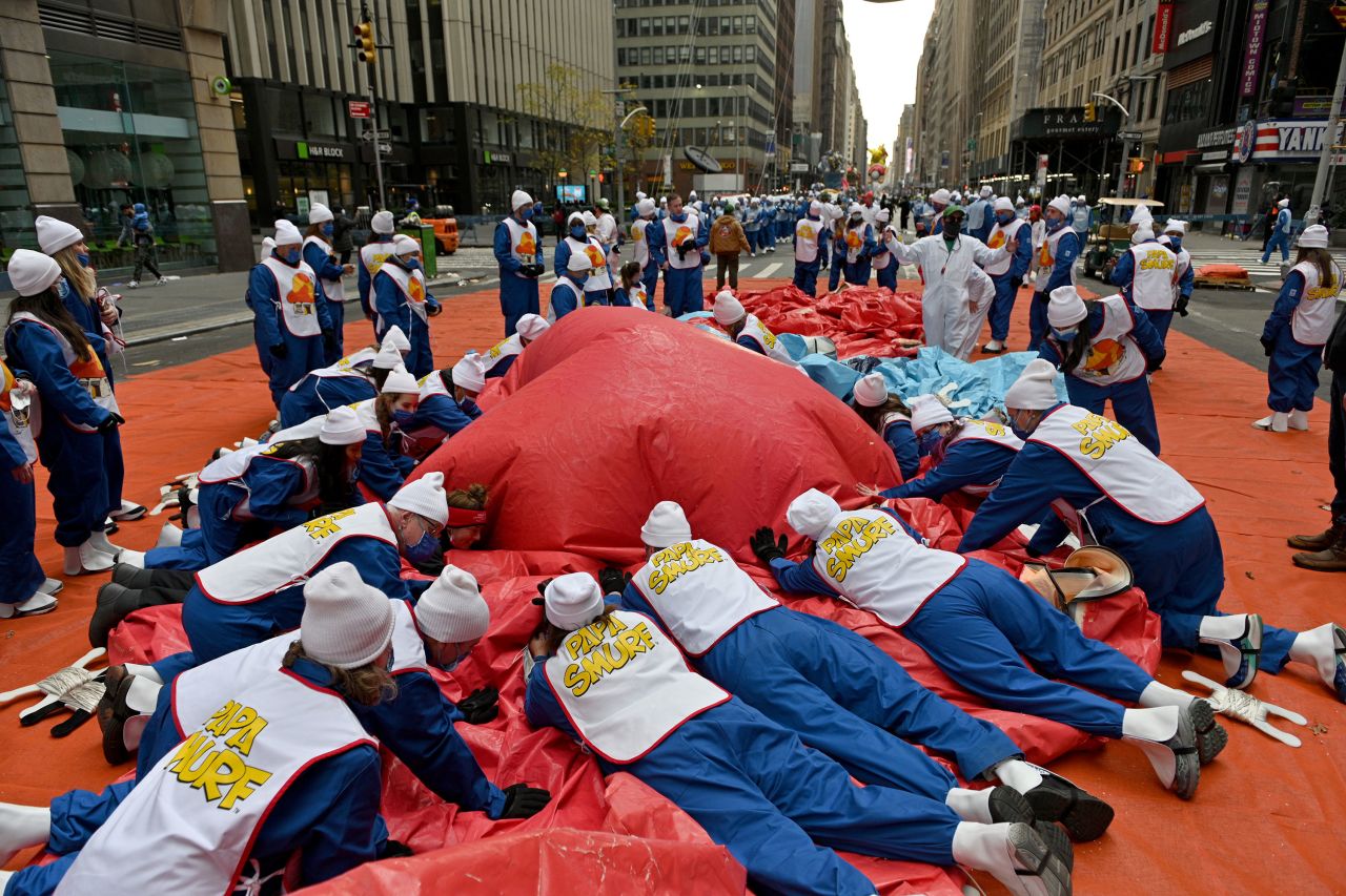 Balloon handlers deflate balloons after the Macy's parade in New York.