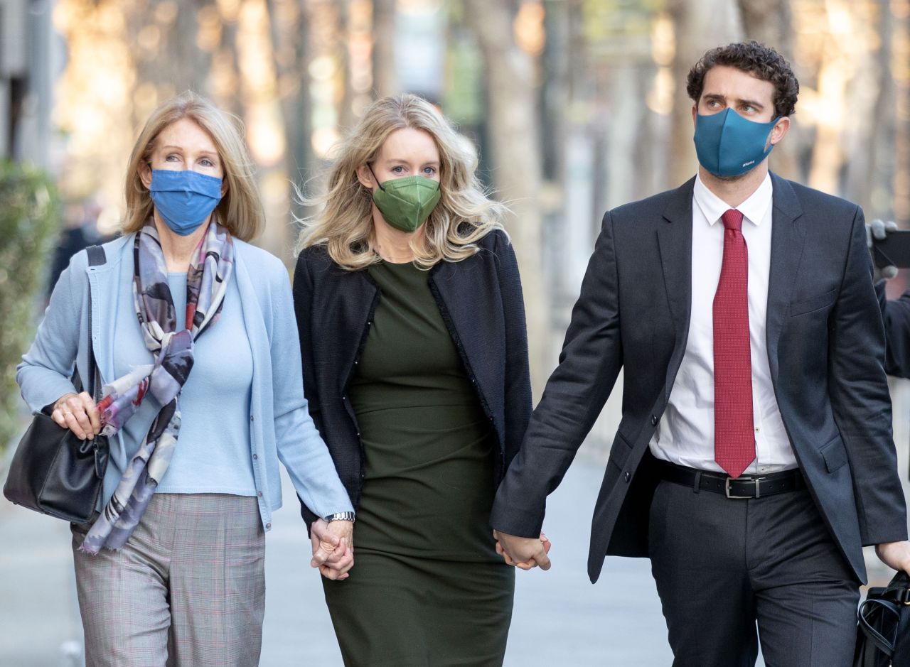 Elizabeth Holmes, center, arrives at a courthouse in San Jose, California, to <a href="https://www.cnn.com/2021/11/24/tech/elizabeth-holmes-trial-recap/index.html" target="_blank">testify in her criminal trial</a> on Tuesday, November 23. Holmes, the founder of the failed blood-testing startup Theranos, has pleaded not guilty to charges that she intended to mislead investors, patients and doctors about the capabilities of her company.