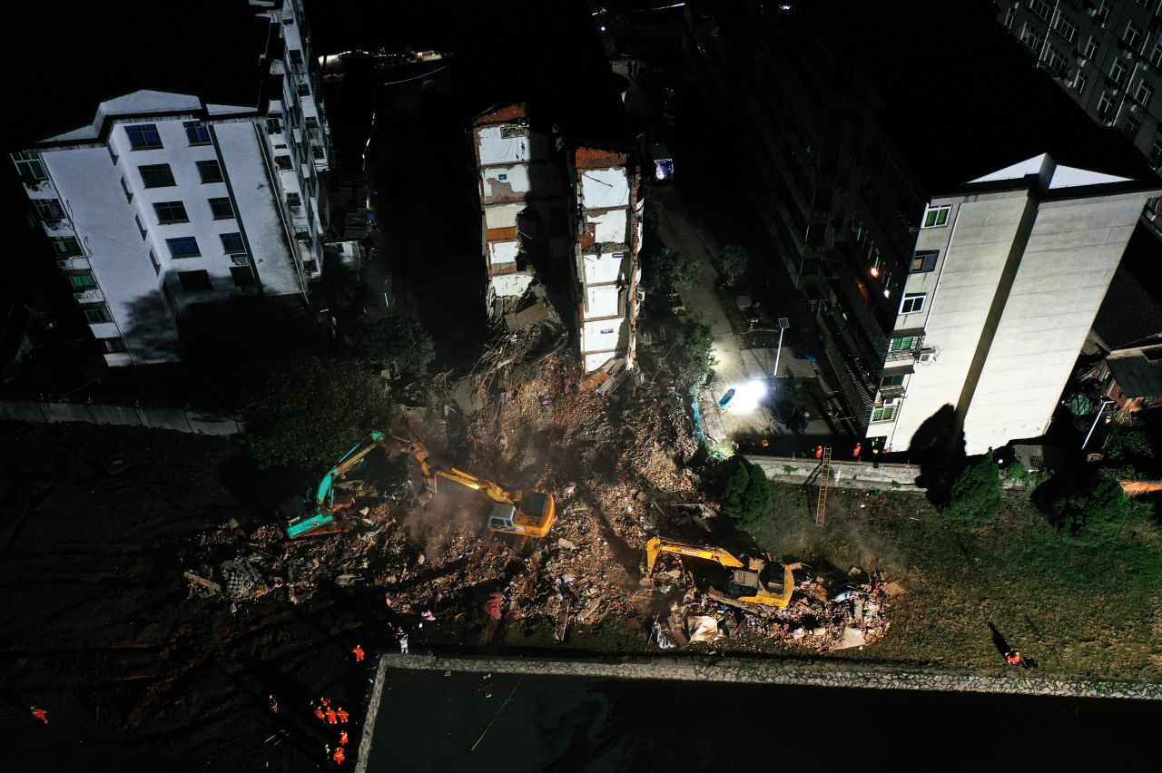 Rescuers work at the scene where a workers' dormitory partially collapsed in Nanchang, China, on Tuesday, November 23. At least four people were killed.