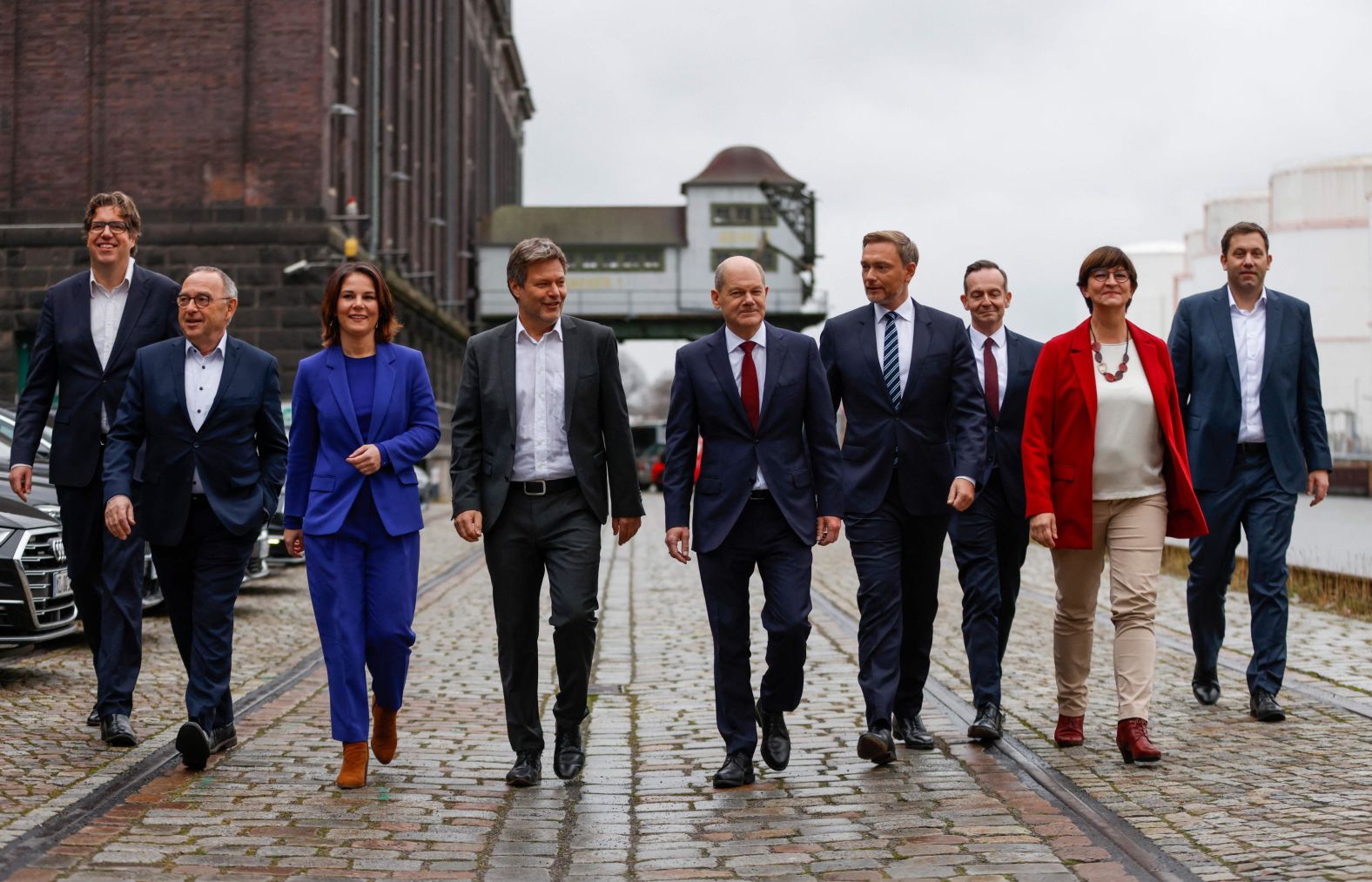 German Vice-Chancellor Olaf Scholz, at center in the red tie, walks with coalition leaders after three political parties <a href="https://www.cnn.com/2021/11/24/europe/germany-coaltion-deal-intl/index.html" target="_blank">sealed a deal for a new government</a> on Wednesday, November 24. <a href="https://www.cnn.com/2021/09/27/europe/olaf-scholz-profile-spd-germany-election-intl/index.html" target="_blank">Scholz</a> has been proposed as the next chancellor to replace outgoing leader <a href="http://www.cnn.com/2013/09/19/europe/gallery/angela-merkel-career/index.html" target="_blank">Angela Merkel.</a>