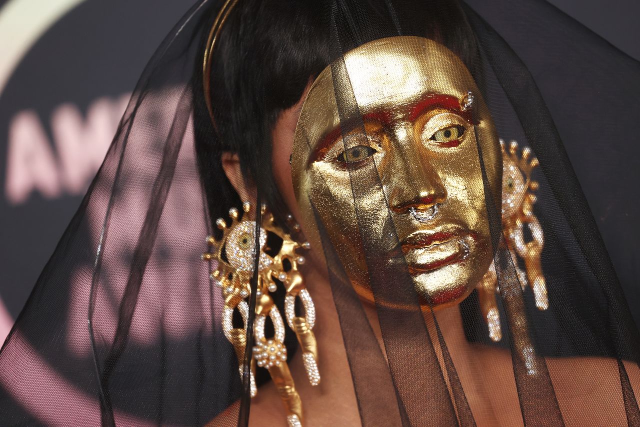 Rapper Cardi B wears a mask on <a href="https://www.cnn.com/style/gallery/2021-american-music-awards-red-carpet-fashion/index.html" target="_blank">the red carpet</a> before hosting the American Music Awards on Sunday, November 21.