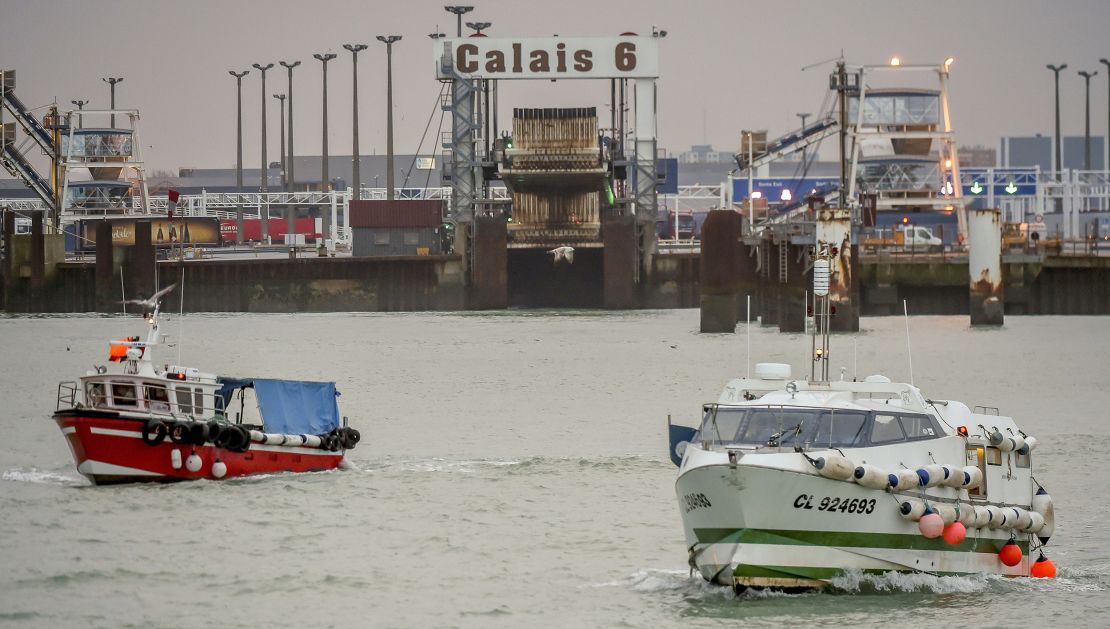 Fishing boats leave the harbor of Calais on January 25, 2018, to take part in a blockade to protest against electric pulse fishing practiced by fishermen from the Netherlands.