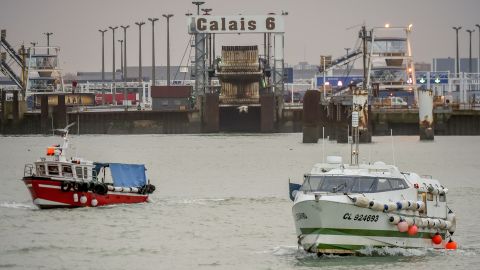 Fishing boats leave the harbor of Calais on January 25, 2018, to take part in a blockade to protest against electric pulse fishing practiced by fishermen from the Netherlands.