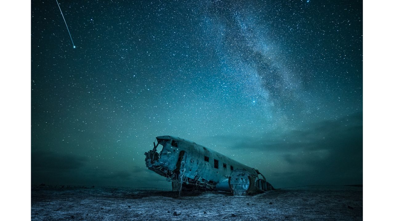 <strong>Sólheimasandur, Iceland:</strong> The wreckage of a US Navy aircraft that crashed in southern Iceland in 1973 is the subject of this dramatic photograph. Ukrainian photographer Yevhen Samuchenko says that his favorite time to take pictures is at night.