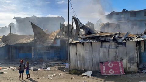 Smoke rises from burned-out buildings in Honiara's Chinatown on November 26.