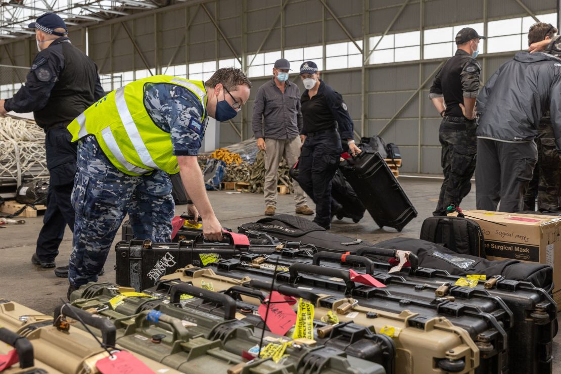 Australian Federal Police Special Operations officers prepare their equipment prior to departure from Canberra to the Solomon Islands capital of Honiara on November 25.