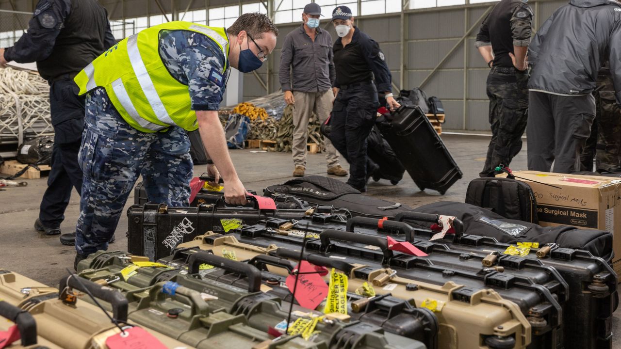 Australian Federal Police Special Operations officers prepare their equipment prior to departure from Canberra to the Solomon Islands capital of Honiara on November 25.