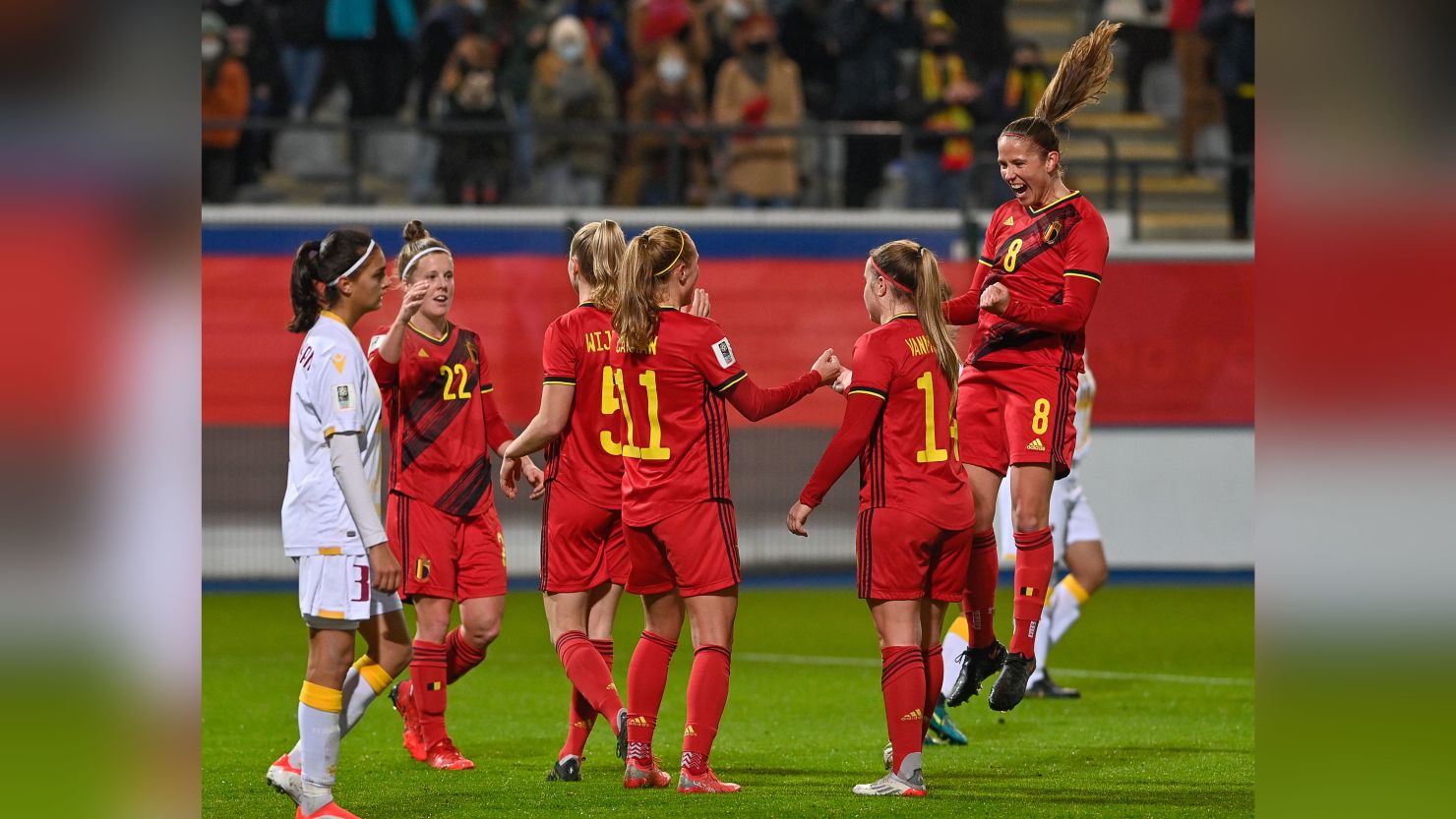 Janice Cayman celebrates with her teammates after scoring during the game against Armenia.