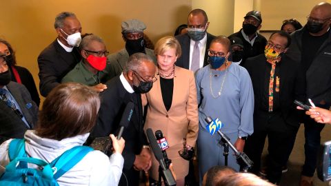 Carl Payne, front left at the microphone, speaks with reporters about his son, Pervis Payne, on Tuesday, November 23, 2021, in Memphis.