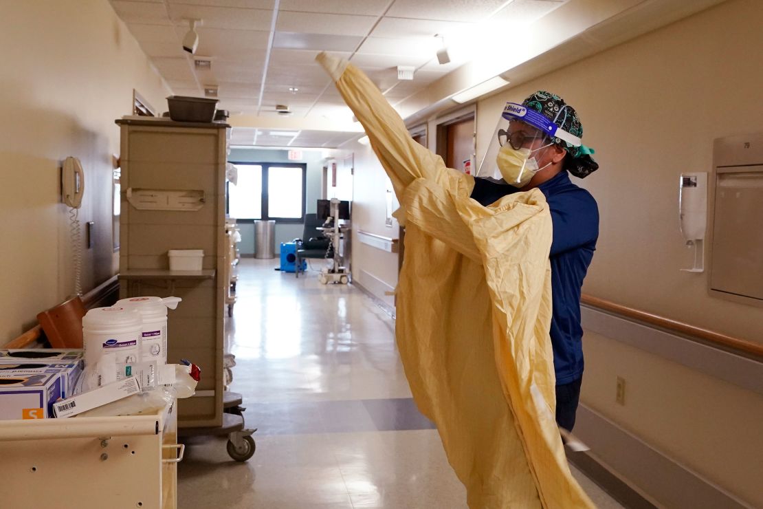 Registered Nurse Monica Quintana dons protective gear  before entering a room at the  Beaumont Hospital in Royal Oak, Michigan, on April 21. 