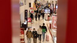 Shoppers walk through Macy's department store in New York City, New York on Black Friday, November 26, 2021.