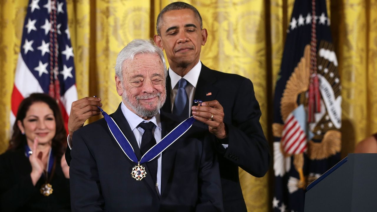 U.S. President Barack Obama (R) presents the Presidential Medal of Freedom to theater composers and lyricists Stephen Sondheim (L)  during an East Room ceremony November 24, 2015 at the White House in Washington, DC. 