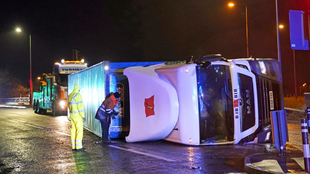 A truck lies on its side in Hartlepool, England after being blown over by gusts of wind of almost 100 mph, which battered some areas of the country during Storm Arwen.