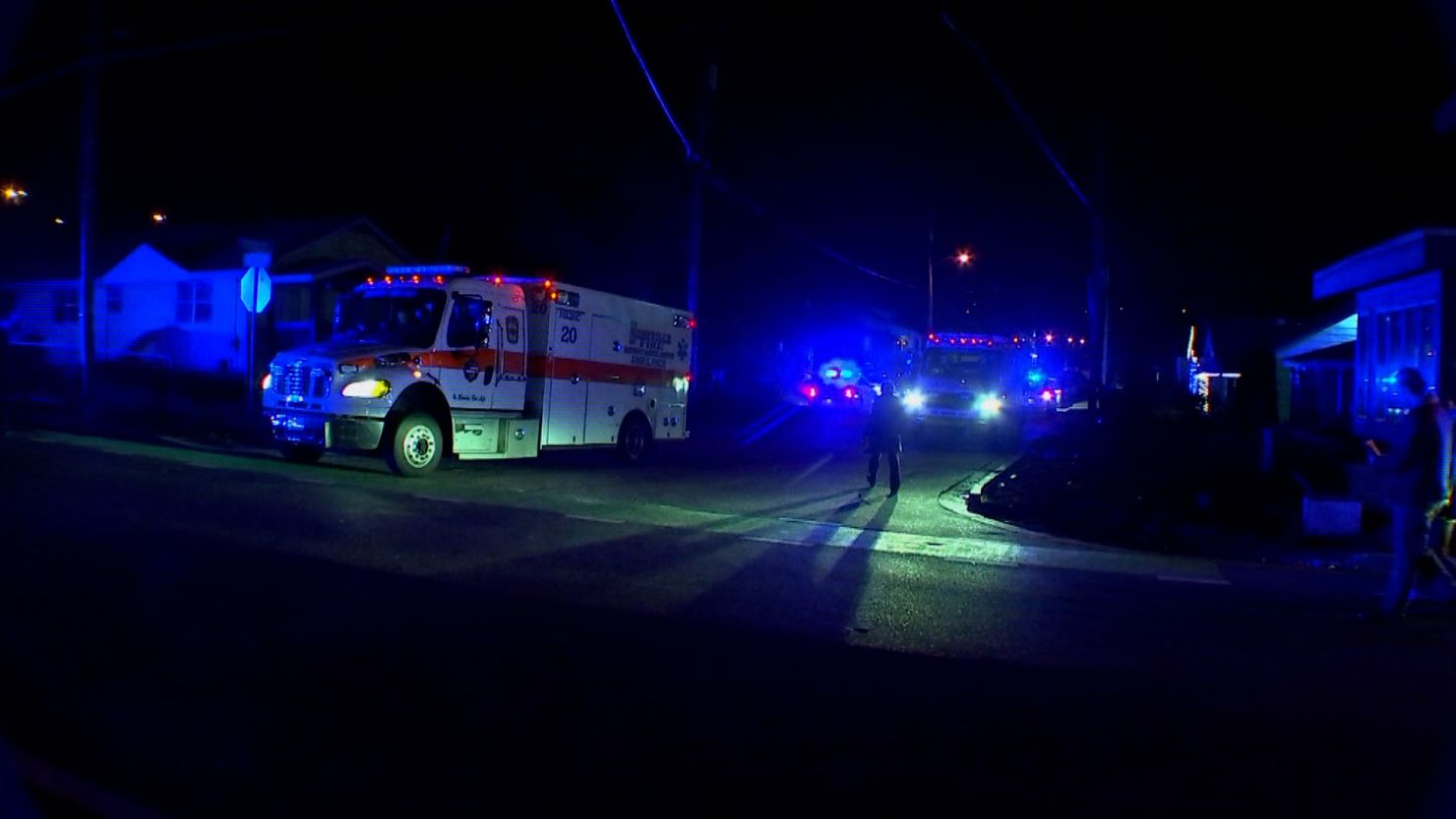 First responders on the scene of a shooting at an apartment in Nashville that left a suspect and two brothers dead.