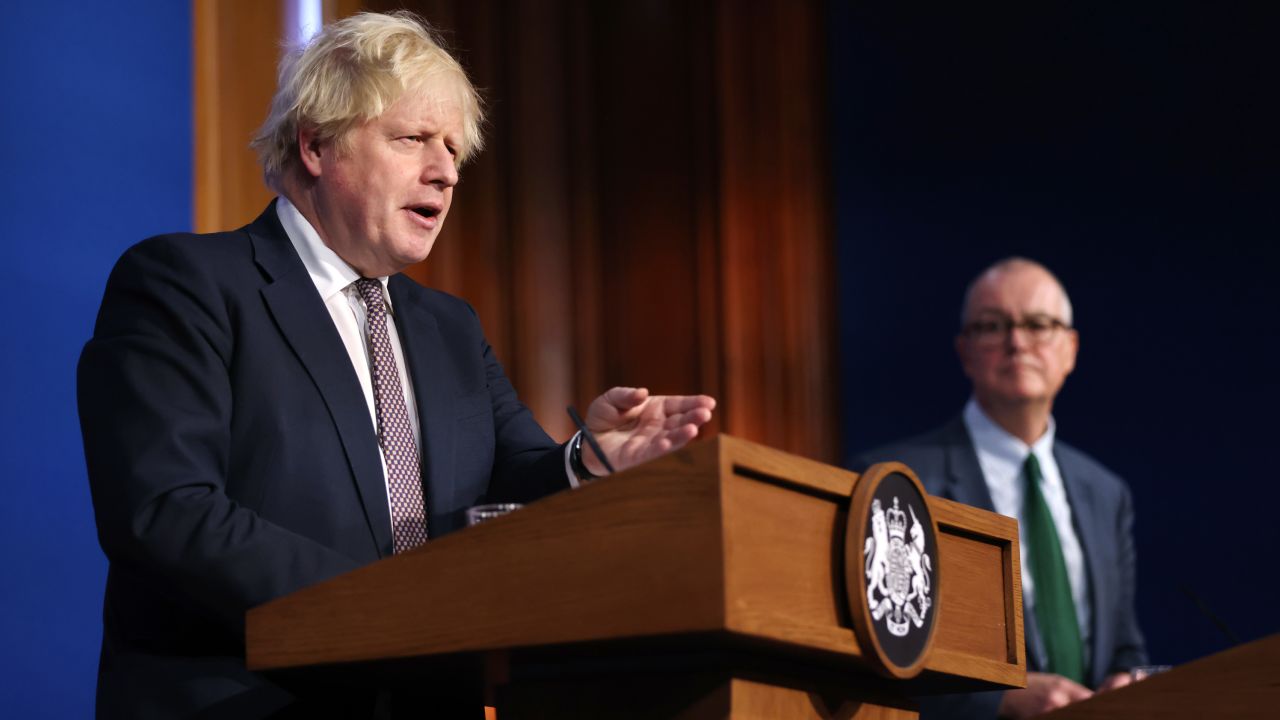 Johnson stands alongside Chief Scientific Adviser Patrick Vallance during a press conference after cases of the new Covid-19 variant were confirmed in the UK on November 27.