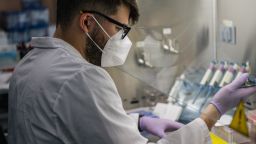 Laboratory Technician David Salazar analyzes COVID-19 samples, during the polymerase chain reaction (PCR) preparation process, at the Genview Diagnosis lab on August 13, 2021 in Houston, Texas.