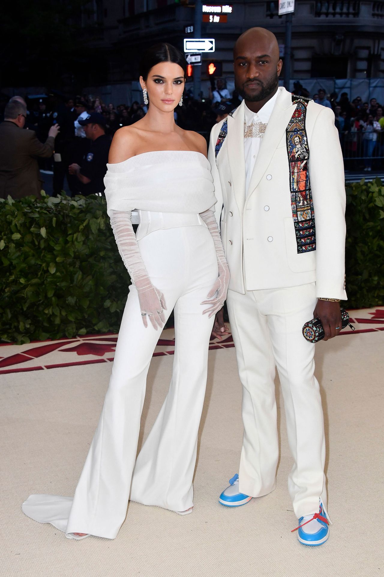 At the 2018 Met Gala, Abloh dressed and accompanied model Kendall Jenner in a trailing jumpsuit by his brand Off-White. The year's theme was "Heavenly Bodies: Fashion & The Catholic Imagination"' and Abloh's white suit featured religious panels designed to look like cathedral stained-glass windows, alongside a pair of blue and white sneakers.