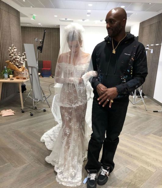 Hailey Bieber, a longtime fan of Abloh's, turned to the designer for one of the most significant dresses of her life: her wedding gown. The off-shoulder lace gown with its swooping back is believed to be the only wedding gown Abloh ever created and he snuck one of his design hallmarks into her trailing power veil, embroidering the words "Till Death Do Us Part" along its train. 