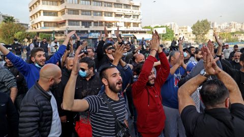 Lebanese protesters clap as they chant slogans during a protest in the capital Beirut on November 29, 2021, as the country struggles with a deep economic crisis. 