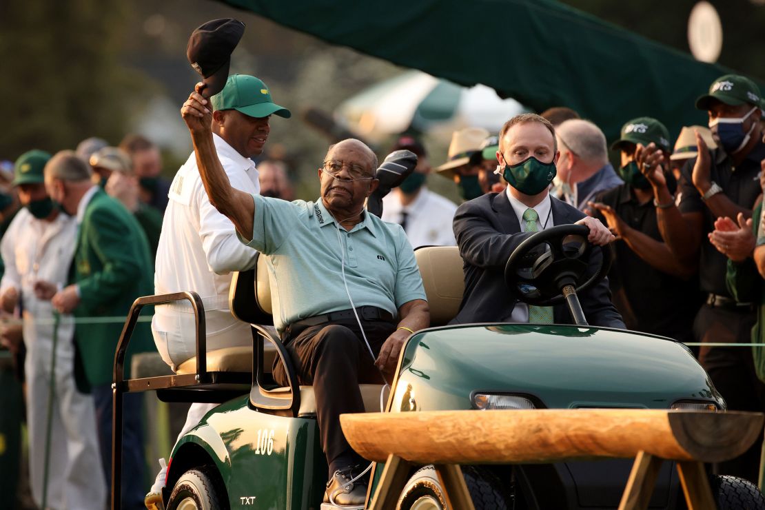 Elder waves to the patrons as he arrives to the opening ceremony prior to the start of the first round of the Masters in 2021.