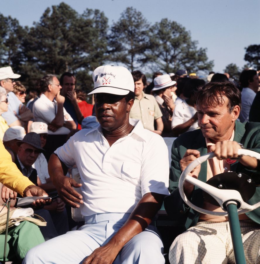 Elder sits in a golf cart while at the 1977 Masters. He missed the cut in his 1975 debut, but he finished tied for 19th in 1977.
