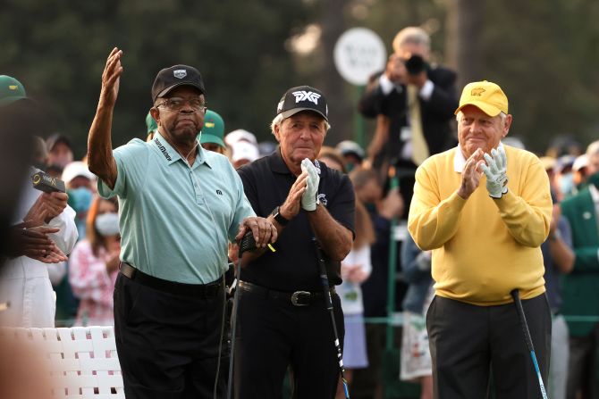 Elder acknowledges applause as he joins Gary Player and Jack Nicklaus as honorary starters at the <a href="index.php?page=&url=https%3A%2F%2Fwww.cnn.com%2F2021%2F04%2F08%2Fgolf%2Fgallery%2Fmasters-golf-2021%2Findex.html" target="_blank">2021 Masters.</a>