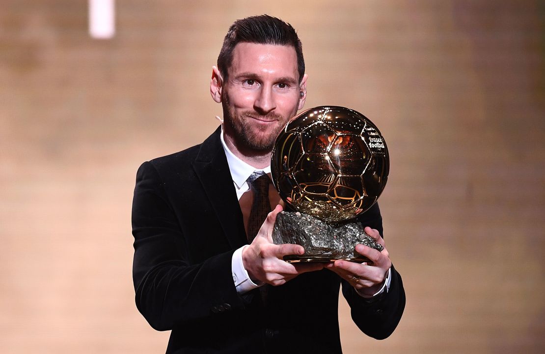 Messi poses with his sixth Ballon d'Or trophy in 2019. 