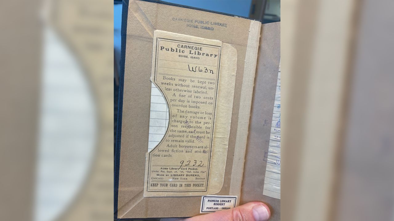 Text inside the cover discusses the fee for overdue books.