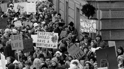 An estimated 5,000 people, women and men, march around the Minnesota Capitol building protesting the U.S. Supreme Court's Roe v. Wade decision, ruling against state laws that criminalize abortion, in St. Paul, Minn., Jan. 22, 1973.  The marchers formed a "ring of life" around the building.  (AP Photo)