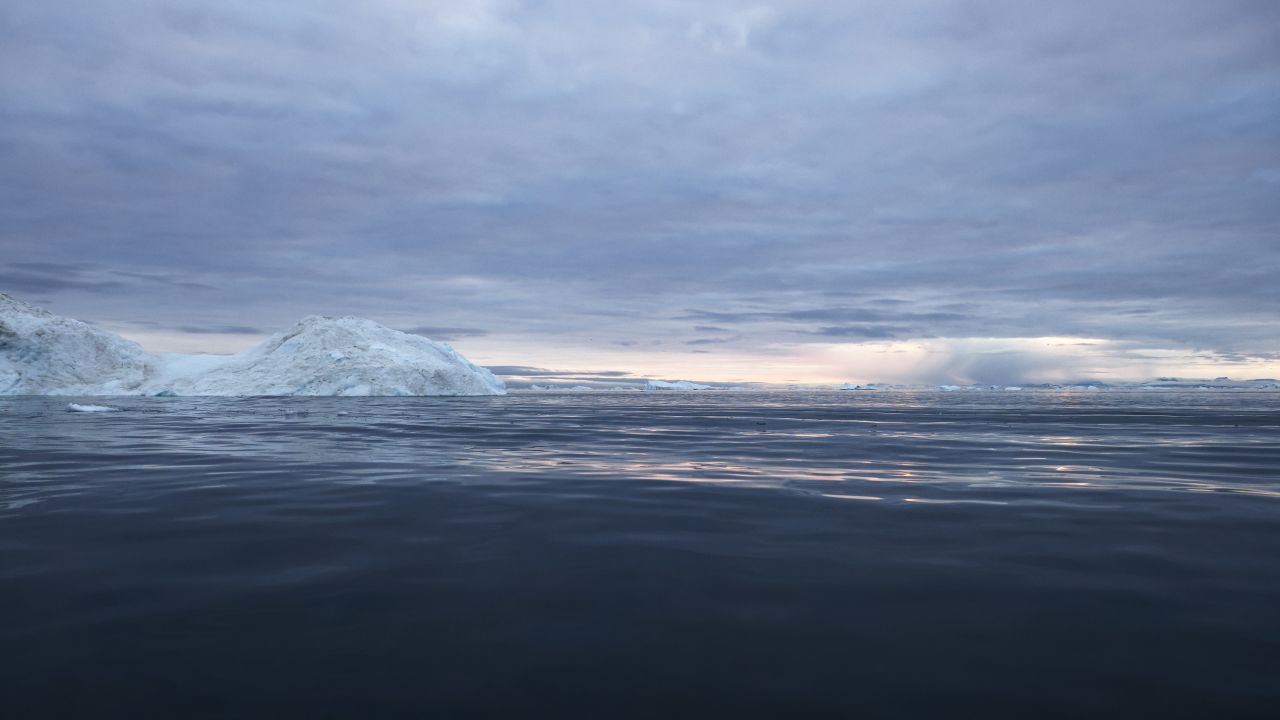 Rain falls in the distance on September 4, off the coast of Ilulissat, Greenland.