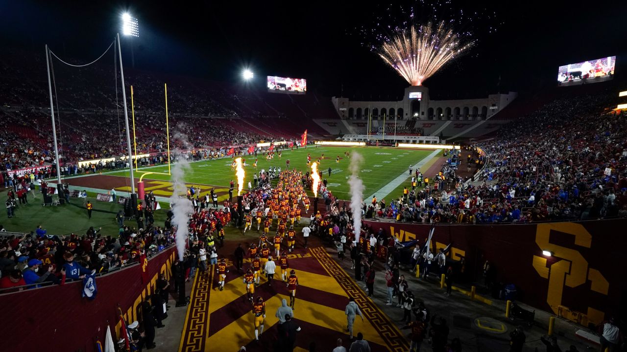 University of Southern California football players enter the field before an NCAA college football game against BYU in Los Angeles, Saturday, Nov. 27, 2021.