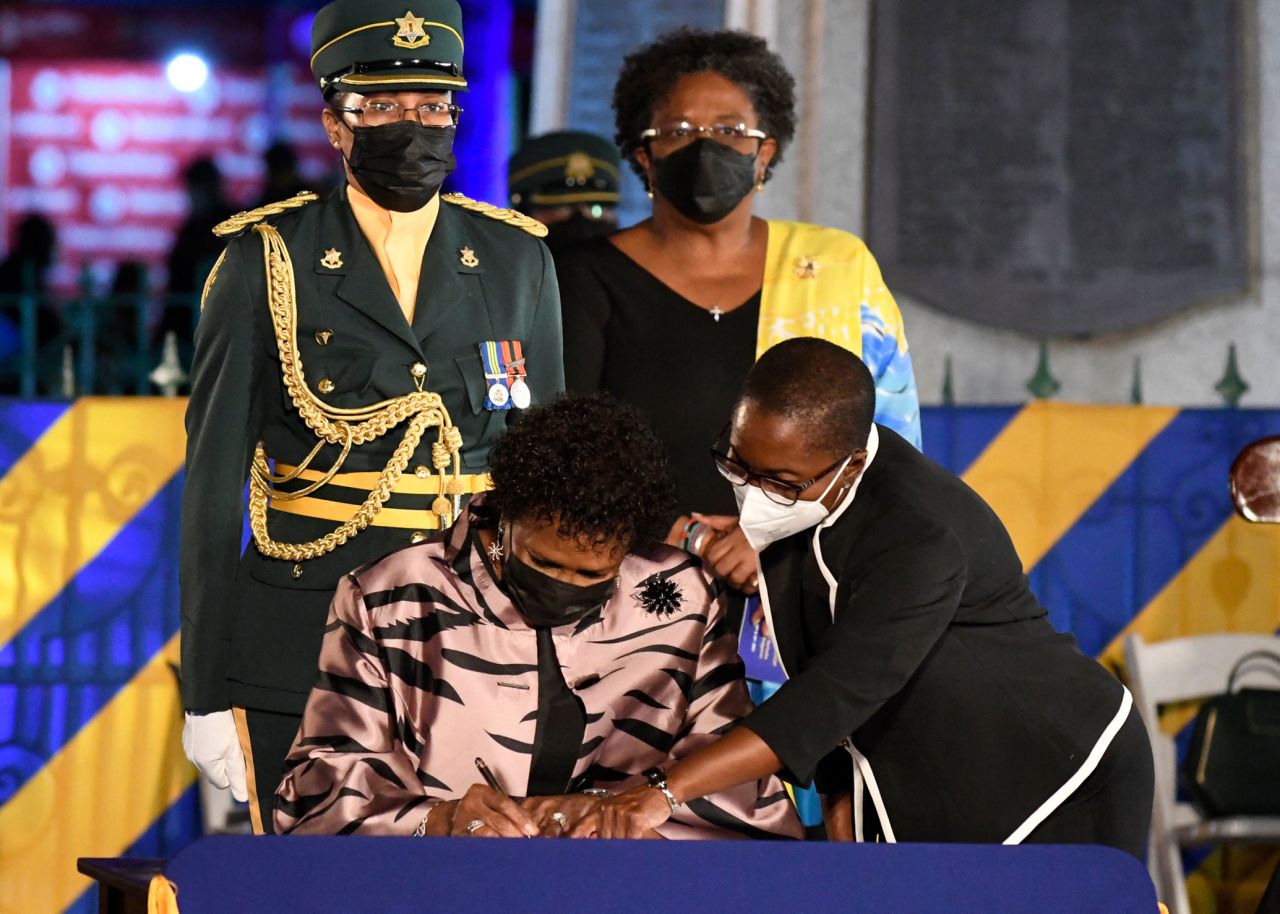 Dame Sandra Mason, is installed as President of Barbados, assisted by the Private Secretary to the Governor-General Sandra Watkins as Major Julia Dabreo and Prime Minister Mia Amor Mottley look on.