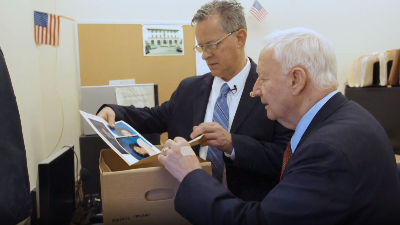 Det. Malcolm Reiman, left, with retired Det. Michael Lagiovane, combed through boxes of evidence in Minerliz's case.