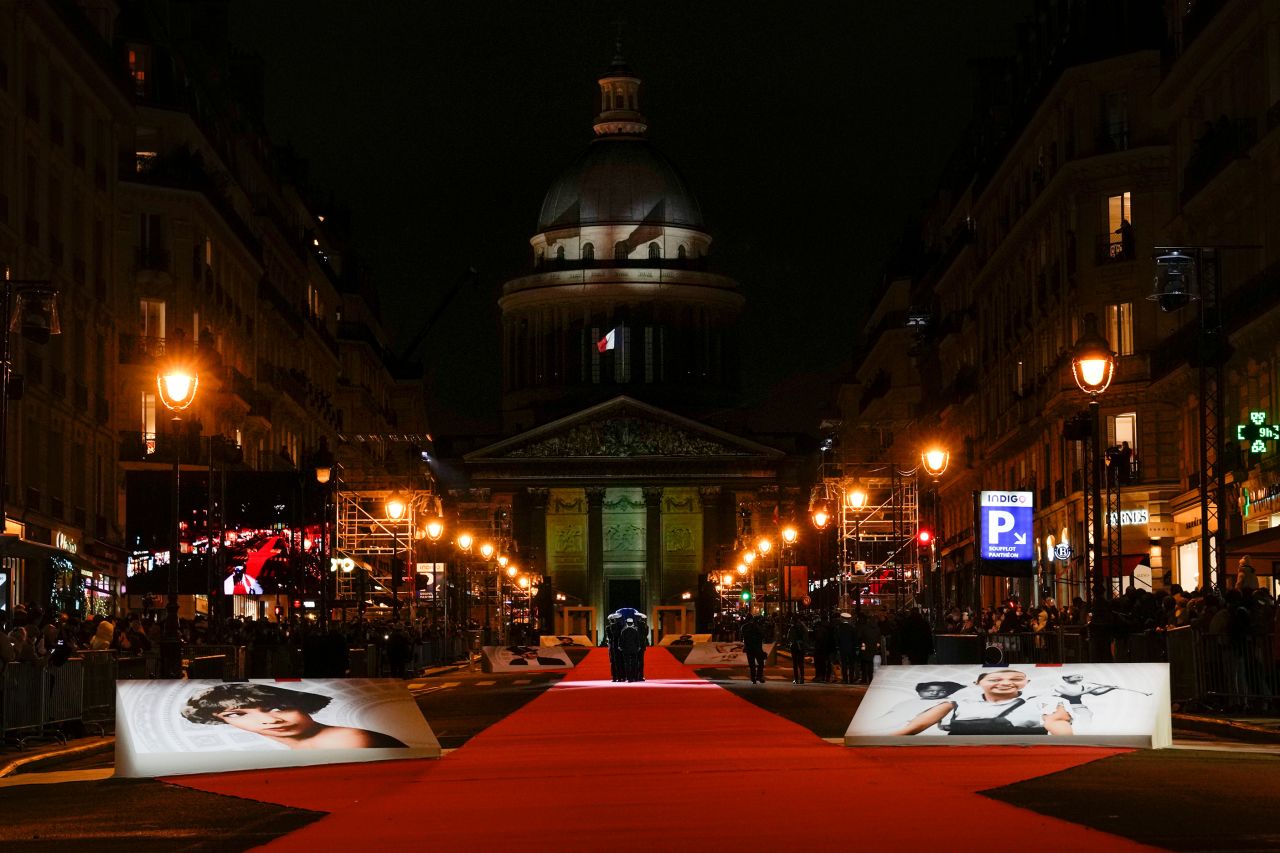 The coffin with soils from the US, France and Monaco is carried towards the Panthéon monument, France, Tuesday.