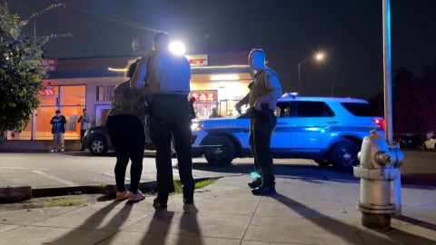 Deputies take a woman out of a busy street. Burk said she could be under the influence of methamphetamine.