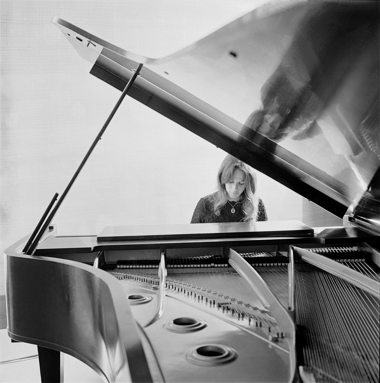 King sitting at a piano while songwriting. "I only wanted to be a songwriter. I never wanted to be a singer. And I never wanted to be famous," King told CBS News.
