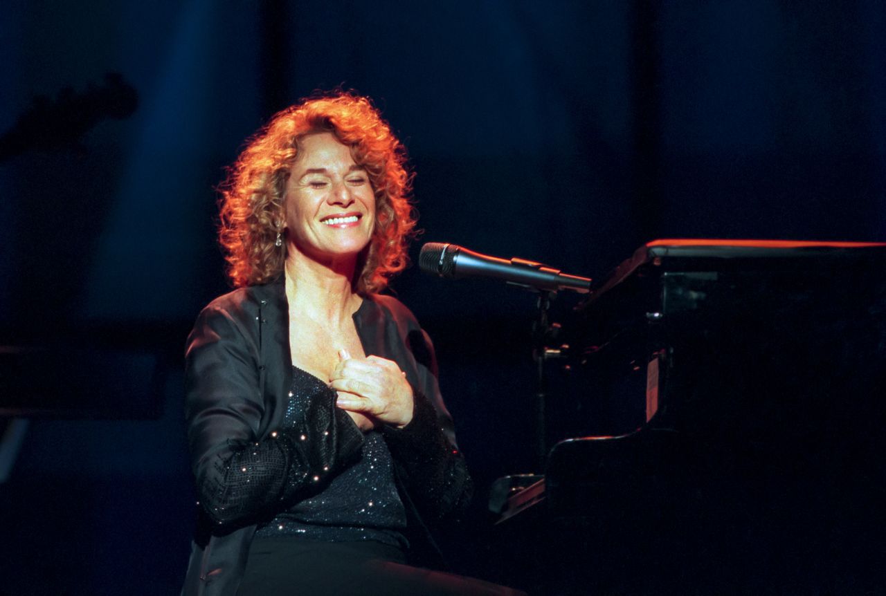 King sits at the piano as she performs at Theater at Madison Square Garden. She was honored at the People Magazine's 25th-anniversary celebration in 1999.