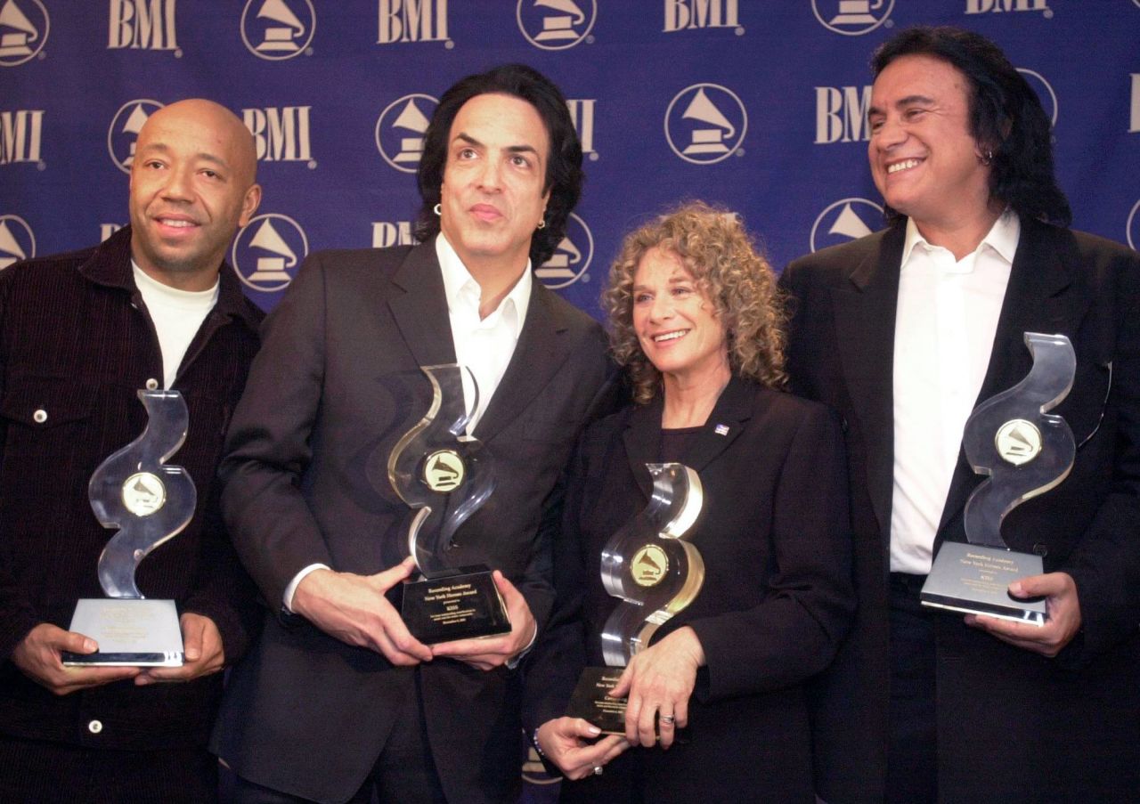 Russell Simmons, Paul Stanley, King and Gene Simmons pose with their 2001 New York Heroes Awards. The New York Chapter of the Recording Academy honored them for their contributions to the music industry and how they give back to their communities.