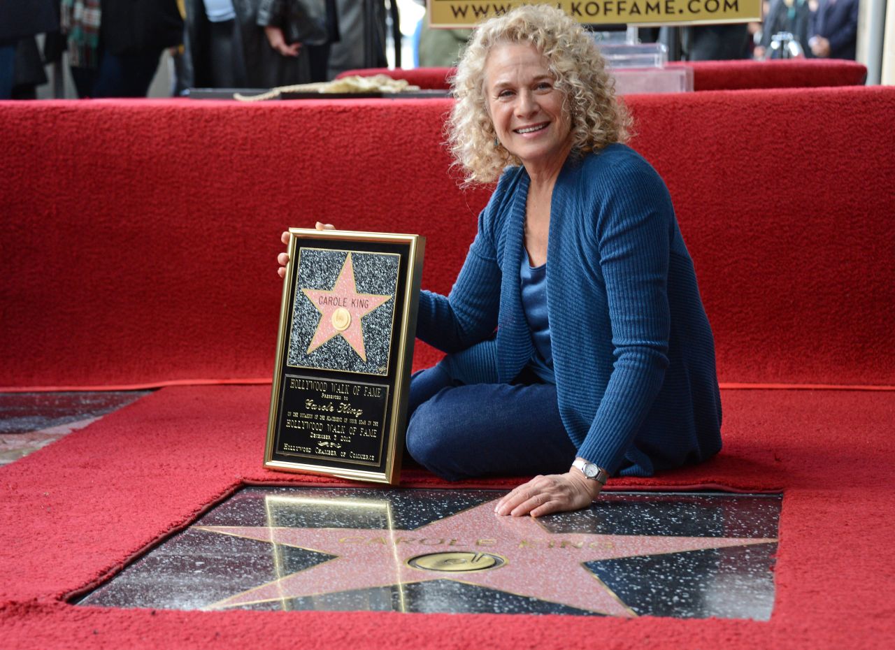 King poses at her star on the Hollywood Walk of Fame after it was unveiled in 2012. "Carole has written numerous songs that are ingrained in the hearts of many and conjure up great memories of times past," said Leron Gubler, Hollywood Chamber of Commerce president and CEO. King received the 2,486th star on the Walk of Fame, according to the <a href="https://walkoffame.com/carole-king/" target="_blank" target="_blank">organization.</a>