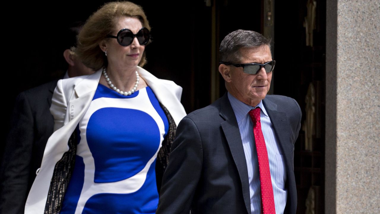 Michael Flynn, former US national security adviser, and lawyer Sidney Powell, left, exit federal court in Washington, D.C., U.S., on Monday, June 24, 2019.