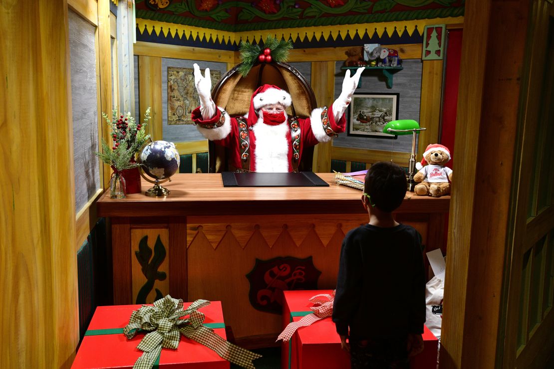 Santa Claus at Macy's Santaland in New York City on November 30, 2021. Some companies have come up with creative ways to make sure Santa is socially distanced during the pandemic. 