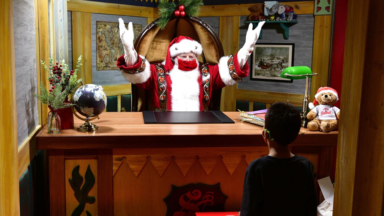 Santa Claus at Macy's Santaland in New York City on November 30, 2021. Some companies have come up with creative ways to make sure Santa is socially distanced during the pandemic.