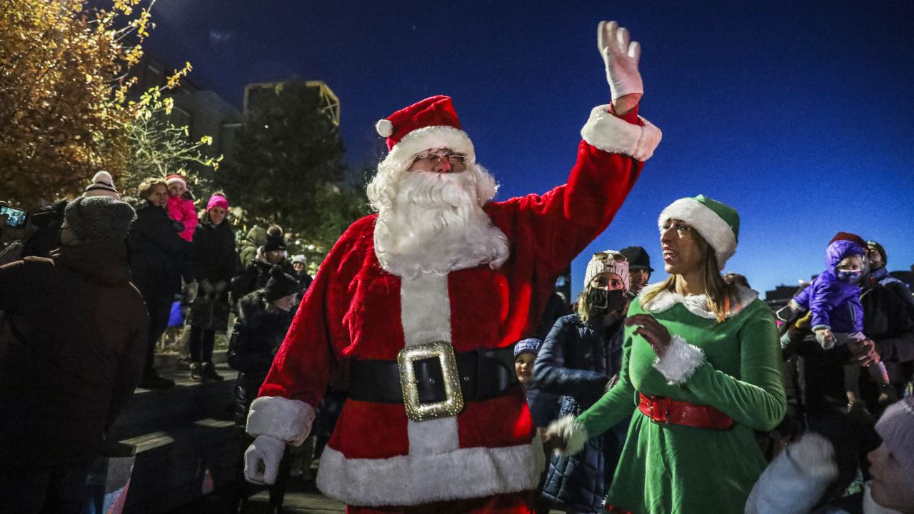 Santa Claus arrives at a holiday event at HarborWalk in Boston on November 21, 2021.  Some companies are already booking Santas for next year's holiday season. 