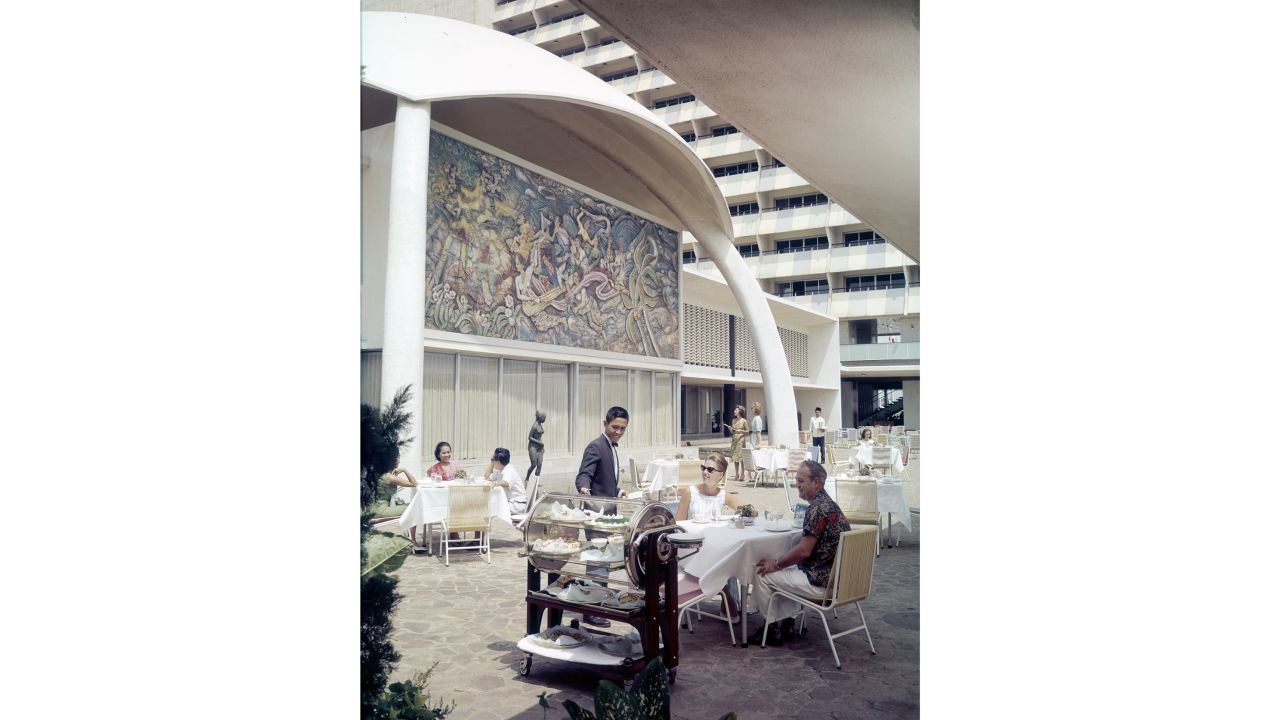 <strong>Stepping into the shot:</strong> Wilma deZanger was also in this image of the Hotel Indonesia in Jakarta Indonesia, which opened in 1962. She's sat alone, on the right, in the far back.